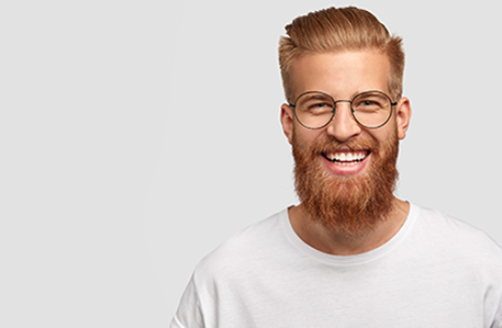 Happy male with long thick ginger beard