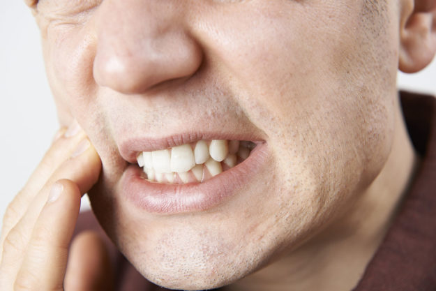 an older person wondering how how does tooth decay develop