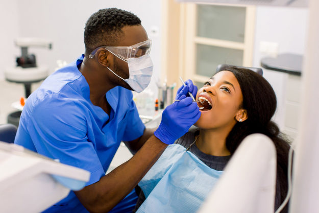 I have a dental emergency (5) dentist working on patient who came to them saying I Have a Dental Emergency