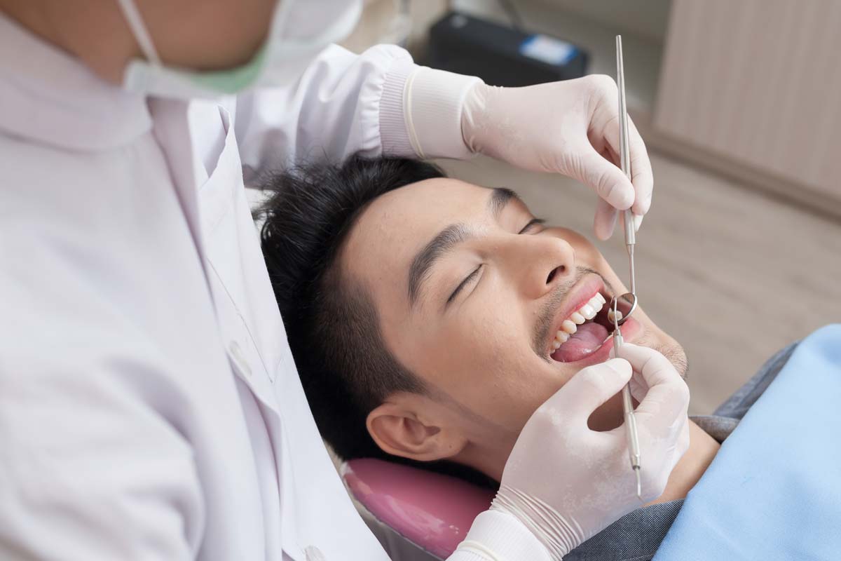 dental-health-services (2) man receiving dental health services