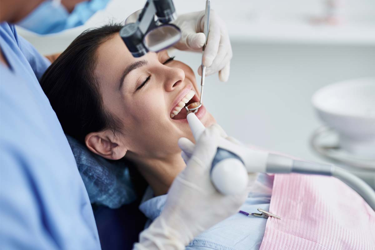 dental-cleanings woman receiving dental cleanings
