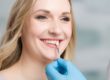 woman learning about dental veneers