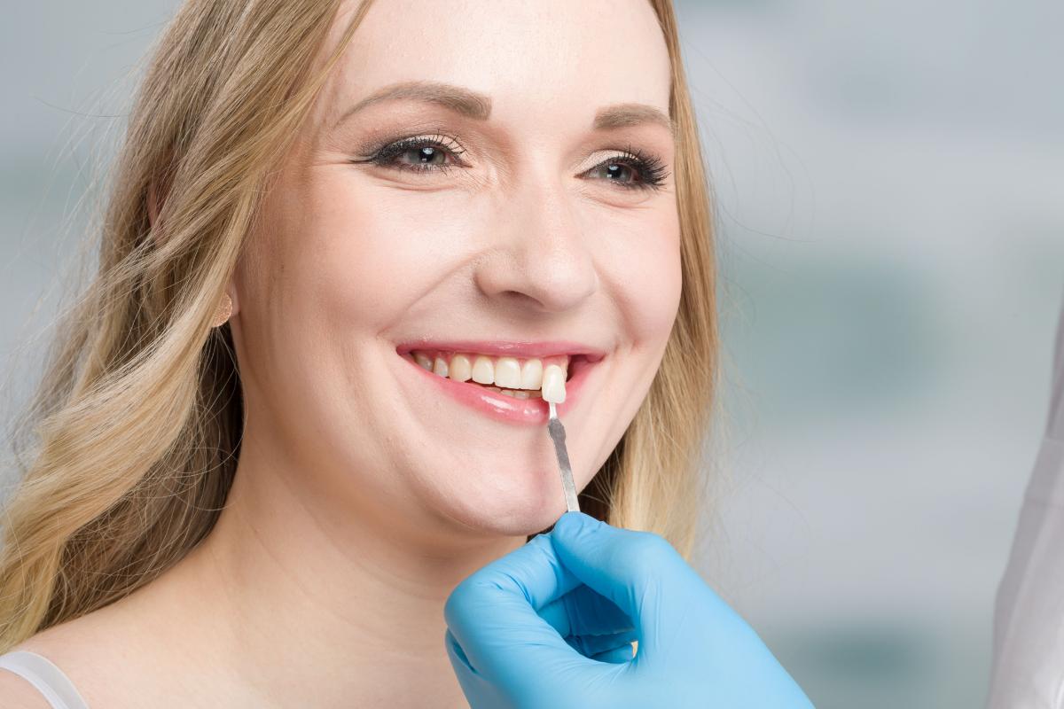 5 Benefits of Dental Veneers (2) woman learning about dental veneers